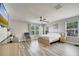 Bright and airy bedroom featuring large windows, neutral walls, and modern furnishings at 3166 Rodrick Cir, Orlando, FL 32824