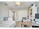 Bedroom features a ceiling fan, built-in bookcase, and desk at 3166 Rodrick Cir, Orlando, FL 32824