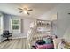 Bedroom with a bunk bed, ceiling fan, and a window with natural light at 3166 Rodrick Cir, Orlando, FL 32824