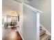 Hallway with hardwood floors leading to a dining area and a staircase to the second floor at 3166 Rodrick Cir, Orlando, FL 32824