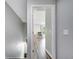 Hallway view with neutral paint leading to a bedroom, showcasing the home's layout and flow at 3166 Rodrick Cir, Orlando, FL 32824