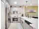 Bright kitchen featuring white cabinets, stainless steel appliances, and subway tile backsplash at 3166 Rodrick Cir, Orlando, FL 32824