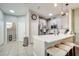 Well-lit kitchen with white cabinets, stainless steel appliances, quartz countertops, and barstool seating at 3166 Rodrick Cir, Orlando, FL 32824
