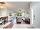 Open-concept living room featuring hardwood floors, a ceiling fan, and a comfortable sectional sofa at 3166 Rodrick Cir, Orlando, FL 32824
