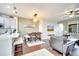 Open concept living space with eat-in kitchen, dining area, and hardwood floors at 3166 Rodrick Cir, Orlando, FL 32824