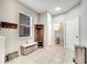 Neutral mudroom with tile flooring and hall tree storage at 3166 Rodrick Cir, Orlando, FL 32824