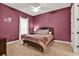 Cozy bedroom features a ceiling fan and a mauve color scheme, creating a relaxing atmosphere at 32613 View Haven Ln, Sorrento, FL 32776