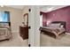View through the doorway of two bedrooms with cozy bedding and a neutral decor palette at 32613 View Haven Ln, Sorrento, FL 32776
