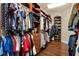 Spacious walk-in closet offering ample storage with custom shelving and organized clothing racks at 32613 View Haven Ln, Sorrento, FL 32776