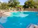 Large community pool with plenty of seating, offering a great place to relax and cool off in the sun at 32613 View Haven Ln, Sorrento, FL 32776
