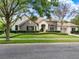 Beautiful single Gathering home with stone accents, manicured lawn, arched entry and a three car garage at 32613 View Haven Ln, Sorrento, FL 32776