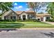 Beautiful single Gathering home with stone accents, manicured lawn, arched entry and a three car garage at 32613 View Haven Ln, Sorrento, FL 32776