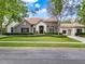 Beautiful single Gathering home with stone accents, manicured lawn, arched entry and a three car garage at 32613 View Haven Ln, Sorrento, FL 32776