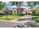 Beautiful single Gathering home with stone accents, manicured lawn, arched entry and a three car garage at 32613 View Haven Ln, Sorrento, FL 32776