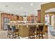 Kitchen with a breakfast bar, granite countertops, stainless steel appliances, and custom wood cabinets at 32613 View Haven Ln, Sorrento, FL 32776