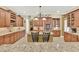 Kitchen with a center island, granite countertops, custom cabinets, stainless appliances, and tile backsplash at 32613 View Haven Ln, Sorrento, FL 32776