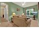 Comfortable living room with plush seating, neutral decor, and a view of the outside from the window at 32613 View Haven Ln, Sorrento, FL 32776