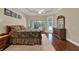 Inviting main bedroom features hard wood floors, a ceiling fan, and an outdoor view at 32613 View Haven Ln, Sorrento, FL 32776
