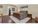 Comfortable main bedroom with wood floors, detailed trim, and a doorway to the closet at 32613 View Haven Ln, Sorrento, FL 32776