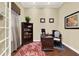Bright home office features hardwood flooring, a stylish desk, shelving, and natural light from the French doors at 32613 View Haven Ln, Sorrento, FL 32776
