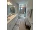 Bathroom featuring double vanity, shower-tub combo and neutral tile flooring at 3399 Buoy Cir, Winter Garden, FL 34787