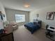 Bedroom with a metal bed frame, natural lighting, and stylish decor at 3399 Buoy Cir, Winter Garden, FL 34787