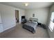 Bedroom featuring a metal bed frame, carpet flooring and an ensuite bathroom at 3399 Buoy Cir, Winter Garden, FL 34787
