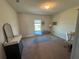 Bedroom featuring neutral walls, carpet and an oval shaped wooden table at 3399 Buoy Cir, Winter Garden, FL 34787