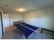 Large bonus room featuring ping pong table and a sitting area at 3399 Buoy Cir, Winter Garden, FL 34787
