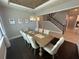 Elegant dining room with wood ceiling, chandelier, and seating for eight at 3399 Buoy Cir, Winter Garden, FL 34787