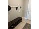 Entryway with a bench and shoe storage and hooks for hats and coats at 3399 Buoy Cir, Winter Garden, FL 34787