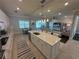 Bright, open-concept kitchen with island seating, stainless appliances, flowing into the comfortable living area at 3399 Buoy Cir, Winter Garden, FL 34787
