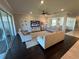 Cozy living room with neutral decor, plush seating, and a wall-mounted television at 3399 Buoy Cir, Winter Garden, FL 34787
