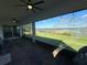 Covered patio with brick flooring featuring ceiling fans and views of the lake at 3399 Buoy Cir, Winter Garden, FL 34787