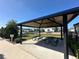 Shaded pavilion with picnic tables overlooking the neighborhood playground at 3399 Buoy Cir, Winter Garden, FL 34787