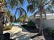 Inviting community pool with ample seating surrounded by lush tropical landscaping at 3399 Buoy Cir, Winter Garden, FL 34787