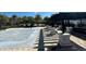 Community pool area with ample seating, lounging, and lush landscaping at 3399 Buoy Cir, Winter Garden, FL 34787