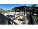 Community pool area with shaded seating, lounge chairs, and a splash pad at 3399 Buoy Cir, Winter Garden, FL 34787