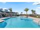 Stunning community pool with palm trees and ample seating offering a resort-style experience at 3399 Buoy Cir, Winter Garden, FL 34787