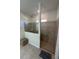 Modern bathroom featuring a walk-in shower with glass partition and neutral tile design at 3399 Buoy Cir, Winter Garden, FL 34787