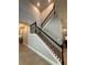 Elegant staircase featuring dark wood banister and neutral carpet at 3399 Buoy Cir, Winter Garden, FL 34787