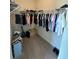 Walk-in closet with clothes racks, shelving, and organized storage solutions at 3399 Buoy Cir, Winter Garden, FL 34787