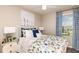 Bedroom features large windows, patterned curtains, and stylish furnishings at 3527 Mayfair St, Kissimmee, FL 34758