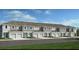 Charming townhomes with attached garages, green grass, and lovely landscaping at 3527 Mayfair St, Kissimmee, FL 34758
