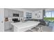 Modern kitchen with gray cabinets, stainless steel appliances, and an island that overlooks the living area at 3527 Mayfair St, Kissimmee, FL 34758