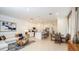 Open concept living room and kitchen featuring modern decor, stainless appliances, and tile flooring at 3535 Mayfair St, Kissimmee, FL 34758