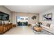 Bright living room featuring stylish decor, modern furniture, and sliding glass doors to the patio at 3535 Mayfair St, Kissimmee, FL 34758
