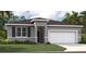 Charming single-story home featuring a manicured lawn, two-car garage, and neutral gray color palette at 415 Shoreview Sands Ave, Mascotte, FL 34753