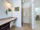 Accessible bathroom featuring granite vanity, shower with safety bars, and ample space for easy access at 4729 Spindletree Ln, Orlando, FL 32829