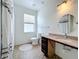 Accessible bathroom design includes vanity, toilet and shower with safety grab bars and ample space at 4729 Spindletree Ln, Orlando, FL 32829